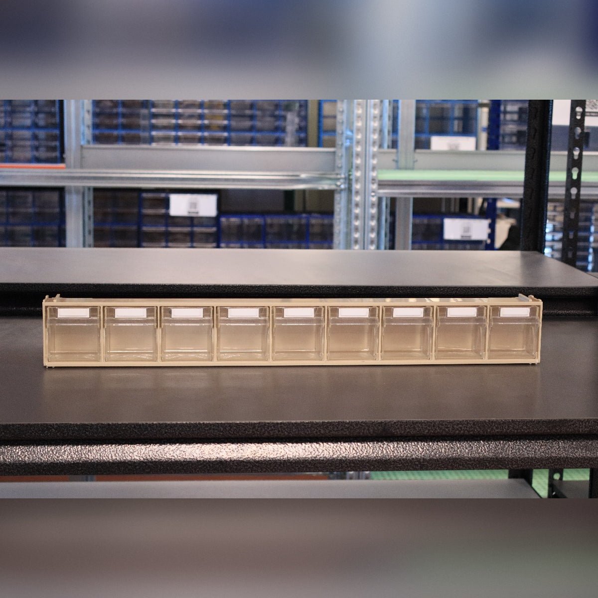 RackZone Storage Tilt Bin Madia 1 (9-Tilt Bin) on a sturdy black metal shelf.