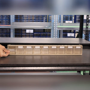 A hand holds a RackZone Storage Tilt Bin Madia 1 (9-Tilt Bin) on a shelf.
