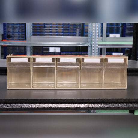 Five RackZone Storage Tilt Bins (5-Tilt Bin) with labels on a black shelf.