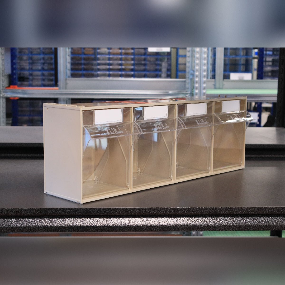 RackZone Storage Tilt Bin Madia 4 for small items on a black warehouse table.