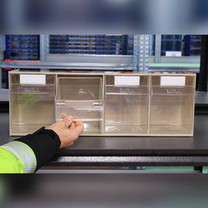 A person opens a compartment of the RackZone 4-Tilt Bin organizer.