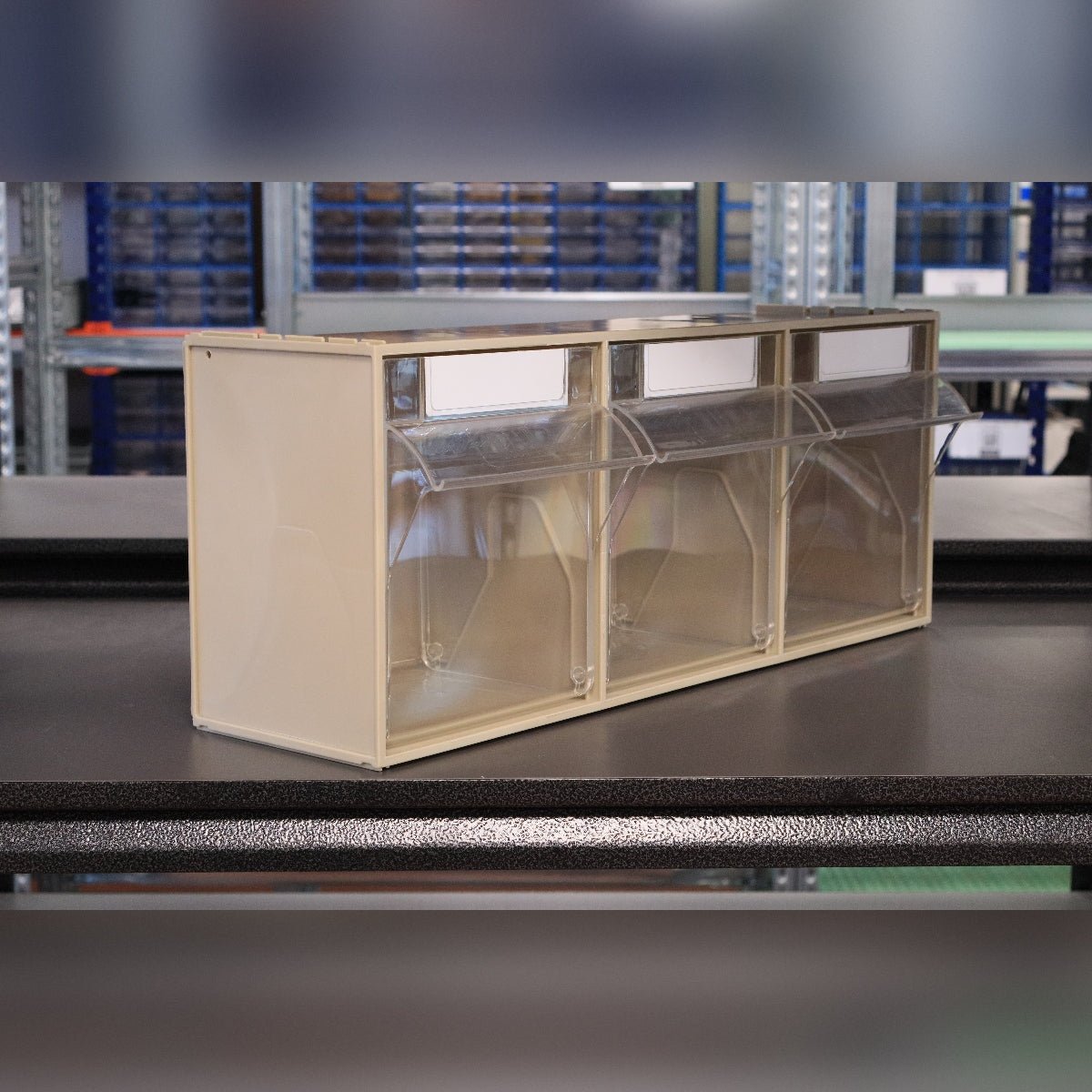 RackZone Storage Tilt Bin Madia 5: 3 beige tilt bins with clear flip-front lids.