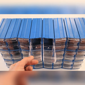 A hand pulls out a RackZone Pull Out Drawer (96/Box) from the organizer.