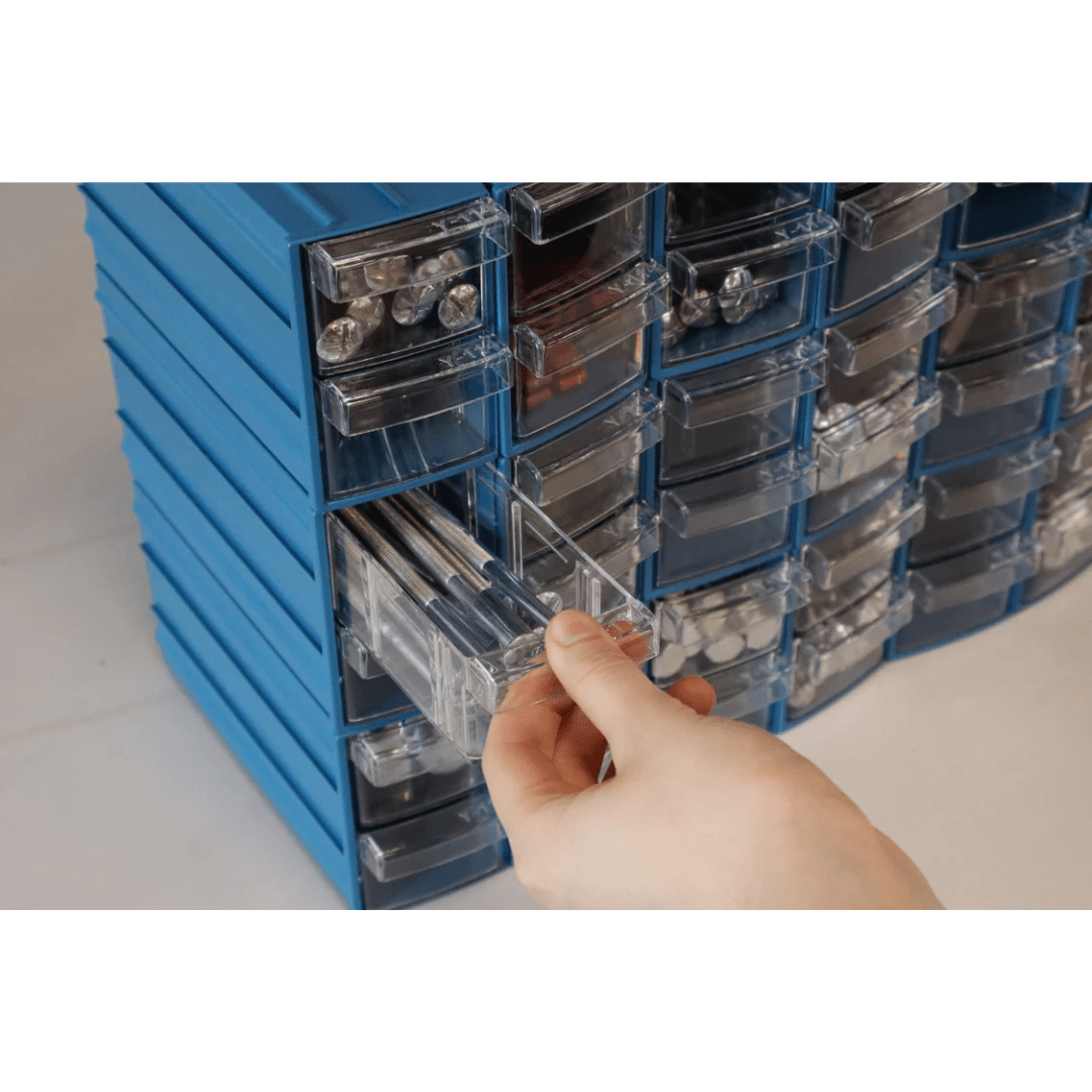 Hand pulls open a RackZone Pull Out Drawer (96/box) from storage organizer.