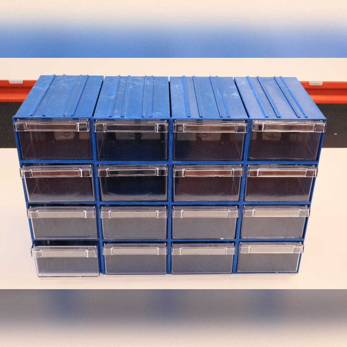 RackZone Plastic Drawer 36 Box, blue, 4 rows of clear drawers for storage.