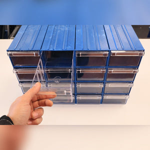 A hand opens a RackZone Plastic Drawer 36 Box organizer in blue.