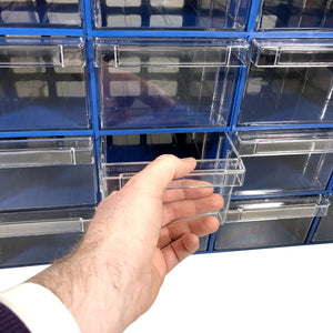 A hand pulls out a clear drawer from the RackZone 32-box blue organizer.