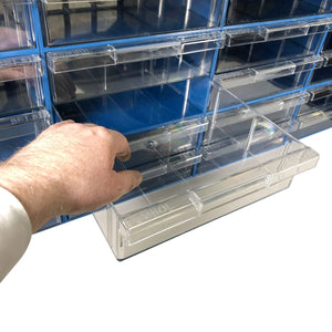 A hand pulls a clear drawer from a RackZone Plastic Drawer [24 Box] organizer.