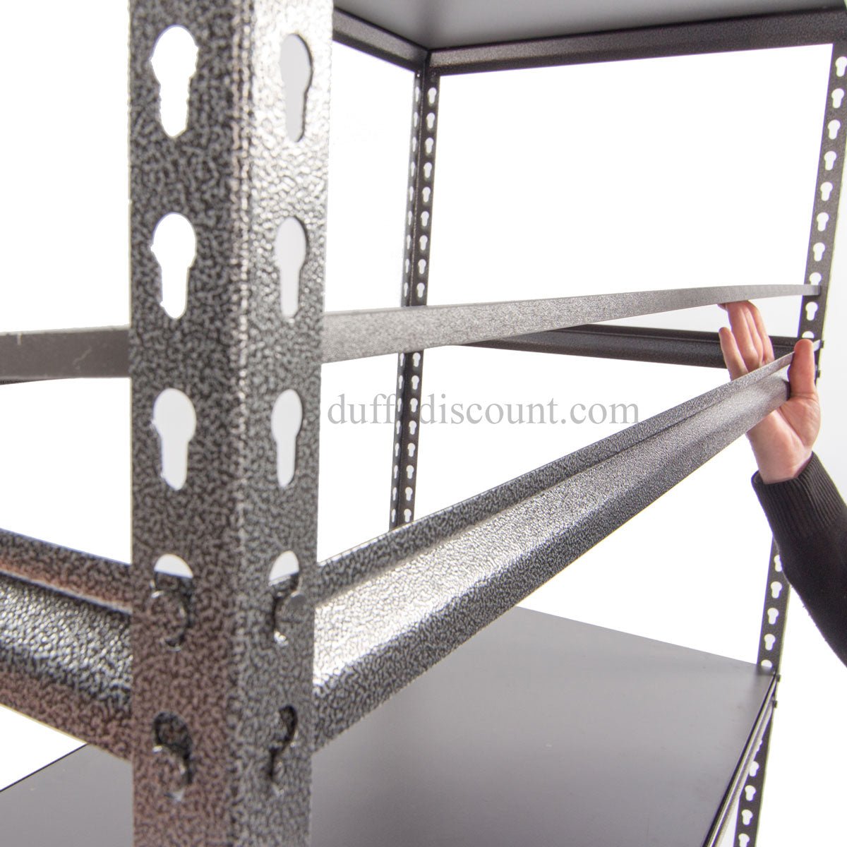 Hand assembling RackZone Rivet Shelving 1830h with notched support beams.
