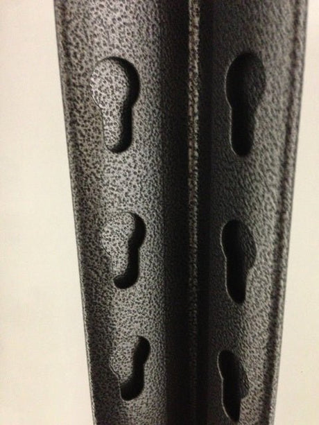 Close-up of RackZone Rivet Shelving bars with keyhole slots in a vertical row.