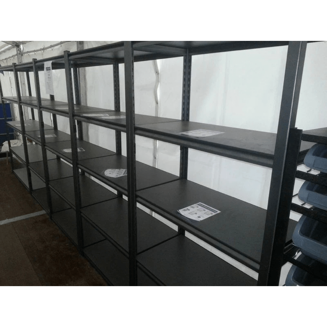 Empty RackZone Rivet Shelving with a few papers on some of the shelves.