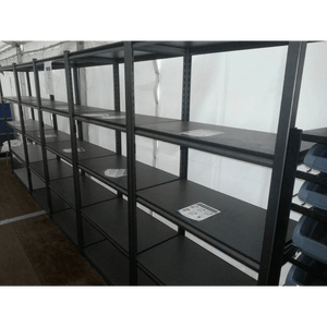 Empty RackZone Rivet Shelving with a few papers on some of the shelves.