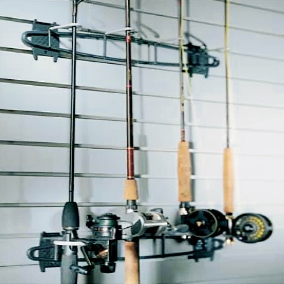Three rods with reels hang on a RackZone Slatwall Fish Hook.
