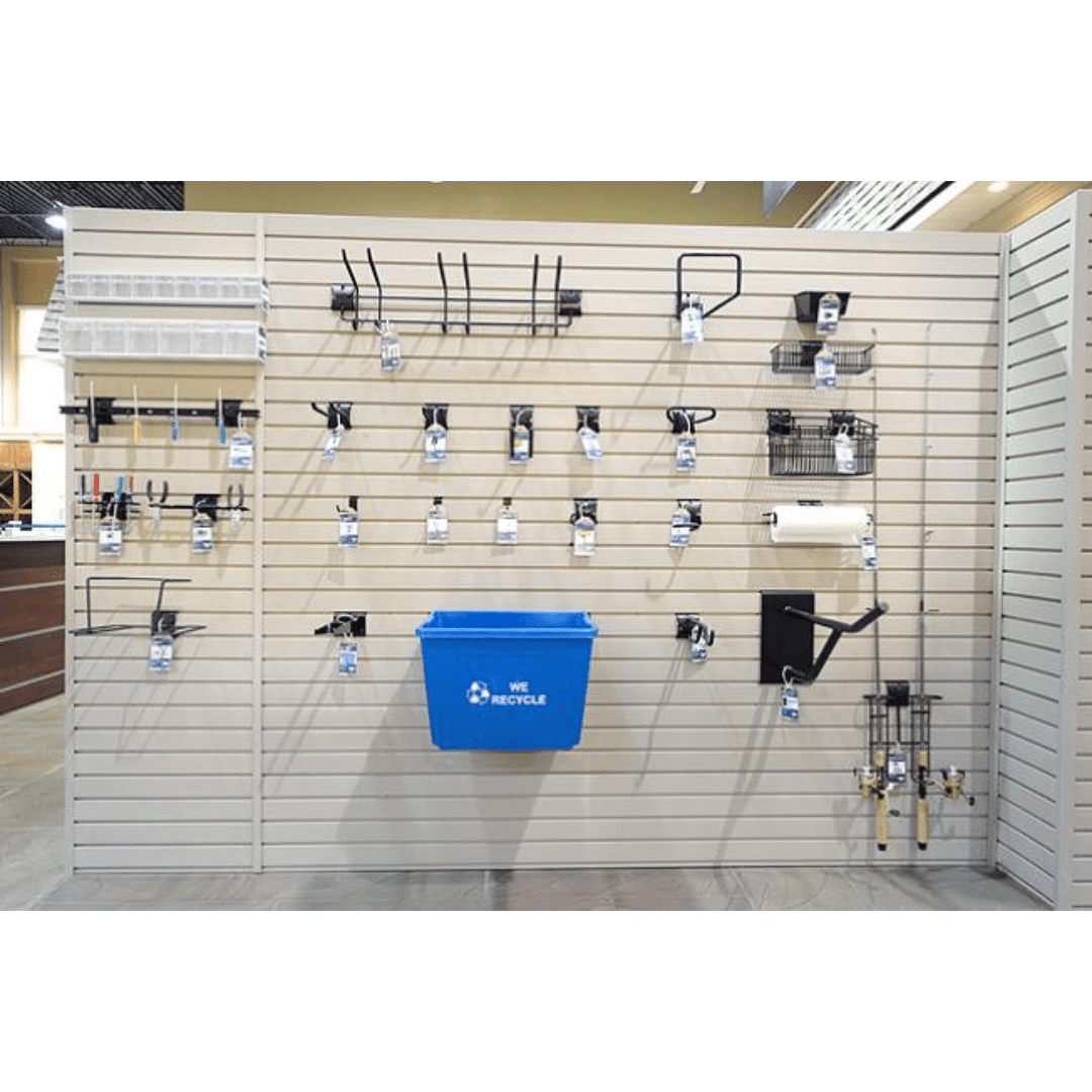 A white RackZone Slatwall PVC panel displays metal hooks, baskets, and a blue bin.