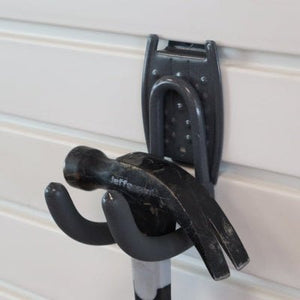 A black hammer hangs on a RackZone Slatwall Work Hook.