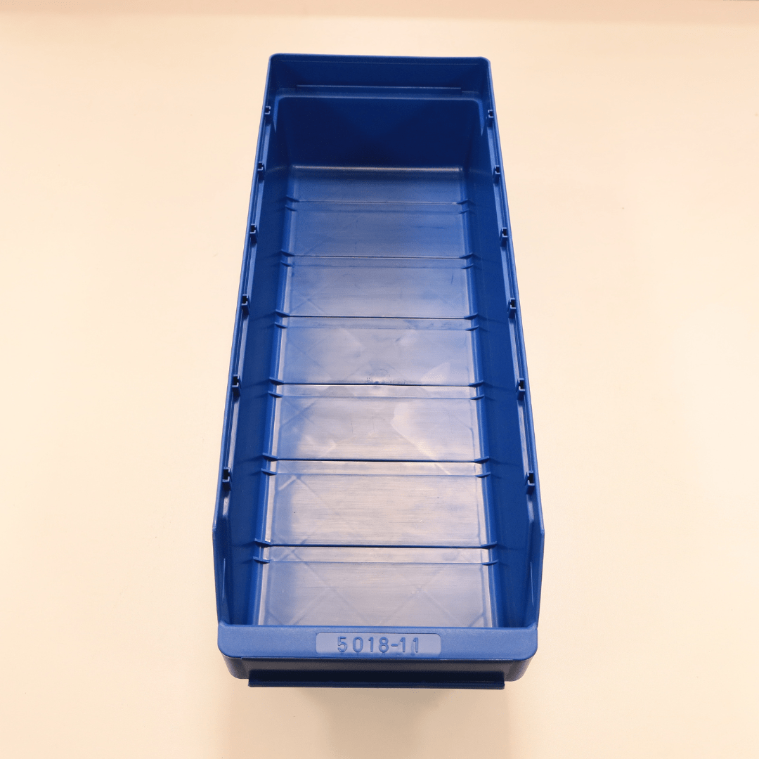 The RackZone ST5018-11 blue shelf bin sits on a light beige surface.