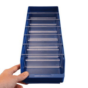 Hand holding a RackZone Standard Shelf Bin ST5018 with clear divider slots.