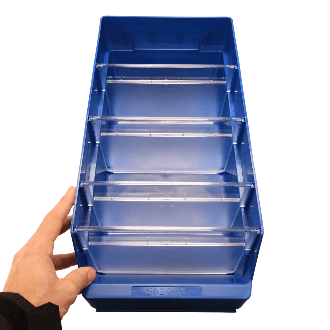Hand holding a RackZone ST5024-15 blue bin with four clear dividers.