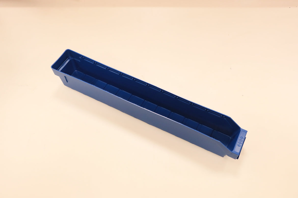 A blue RackZone ST6009 shelf bin sits on a light-colored surface.