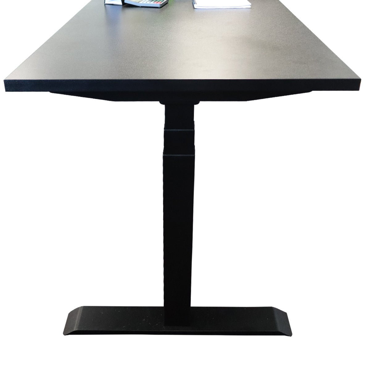 RackZone L-Shaped Sit-Stand Desk with electric height adjustment and books.