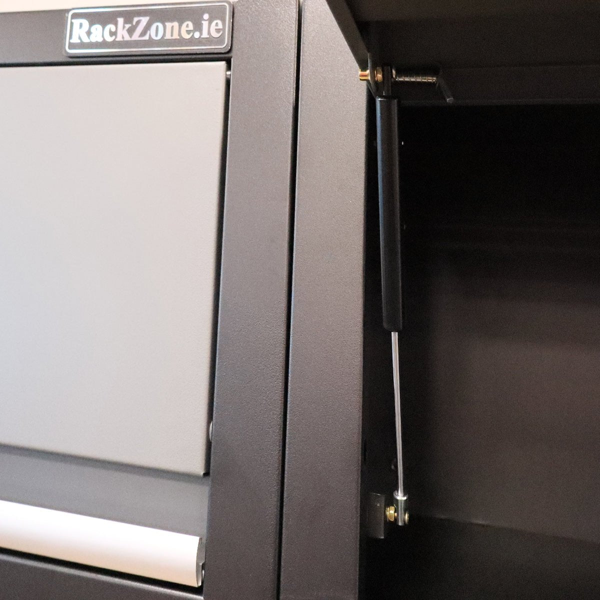 Close-up of Modular Workstation System 7 hinge with a RackZone label visible.
